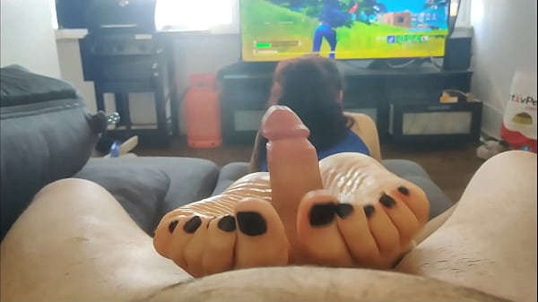 my step sister gives me an oiled footjob with her black toes while playing Fortnite